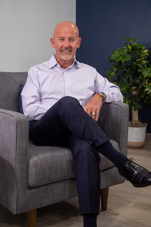 Steve Lowisz seated in a chair