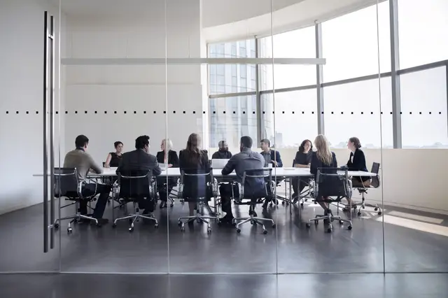 Community bank boardroom during a facilitated strategy session