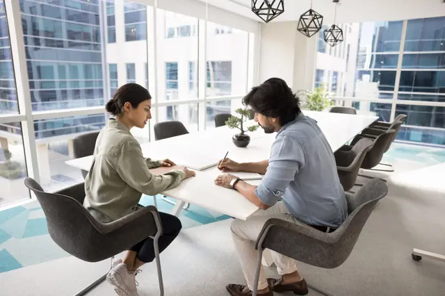 A structured coaching conversation between two community bank leaders
